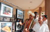Unique wedding  photojournalist displays photos in wedding hall